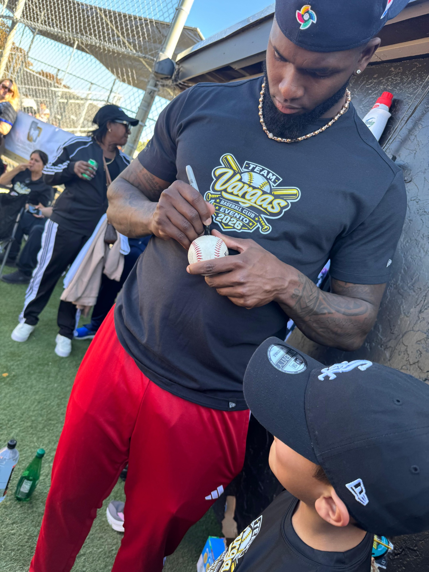 Signing autographs for young fans
